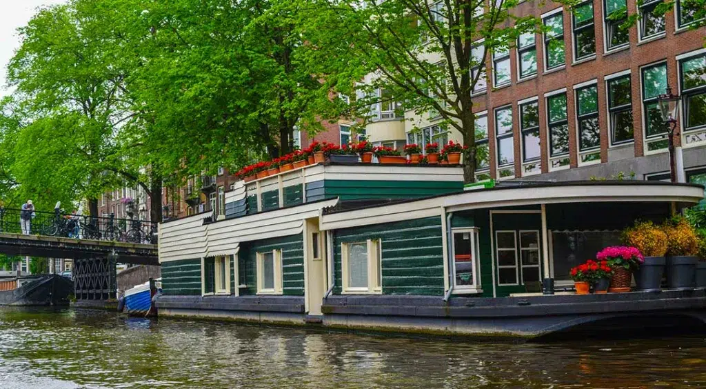 Unusual Romantic Weekend Breaks Europe for Couples -  booking a houseboat on the Amsterdam canals.